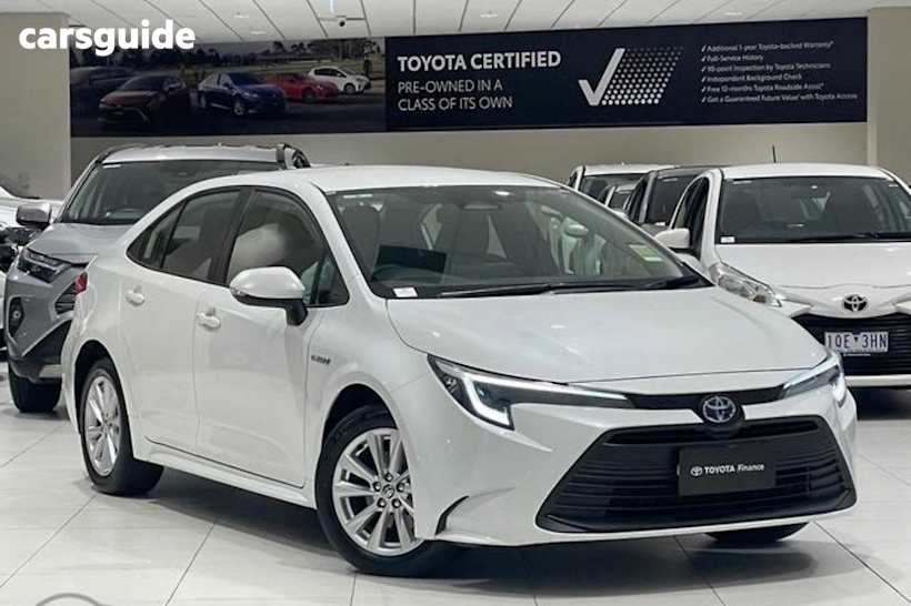 White 2024 Toyota Corolla Sedan ASCENT SPORT HYBRID F