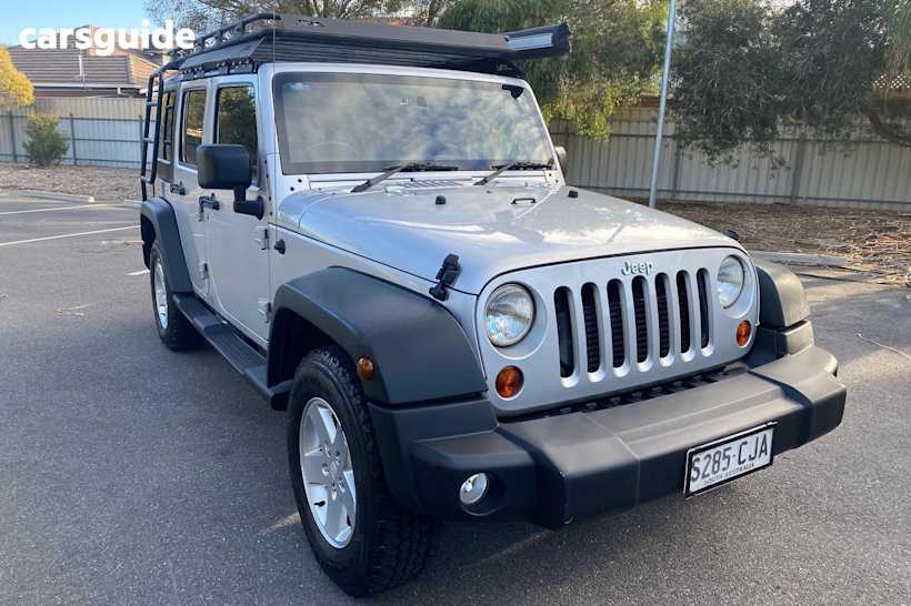 Silver 2011 Jeep Wrangler SUV UNLIMITED SPORT 4X4