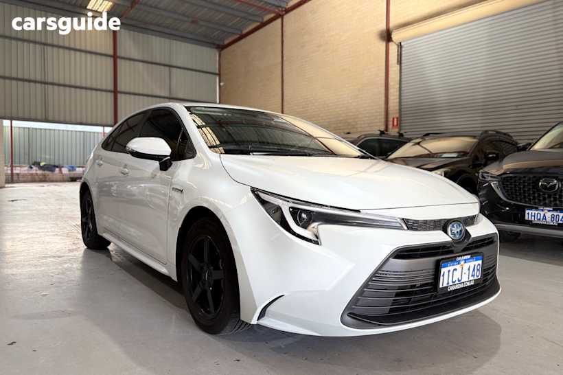 White 2023 Toyota Corolla Sedan ASCENT SPORT HYBRID F