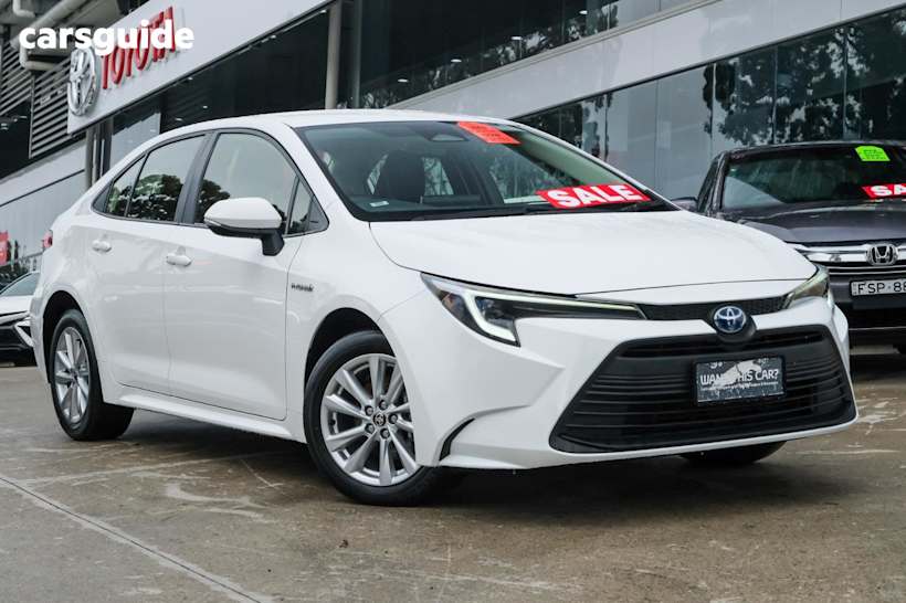 White 2023 Toyota Corolla Sedan ASCENT SPORT HYBRID F