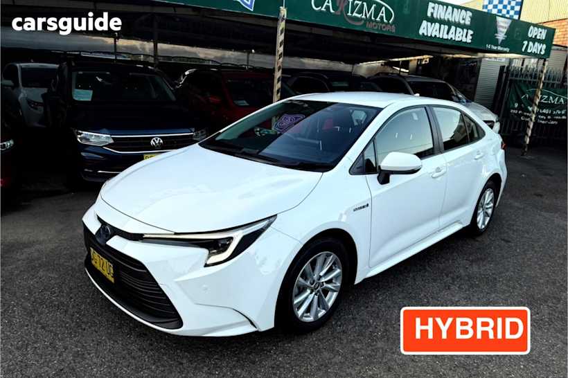 White 2023 Toyota Corolla Sedan Ascent Sport Hybrid