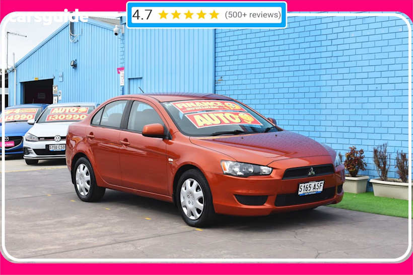 Orange 2012 Mitsubishi Lancer Sedan ES F