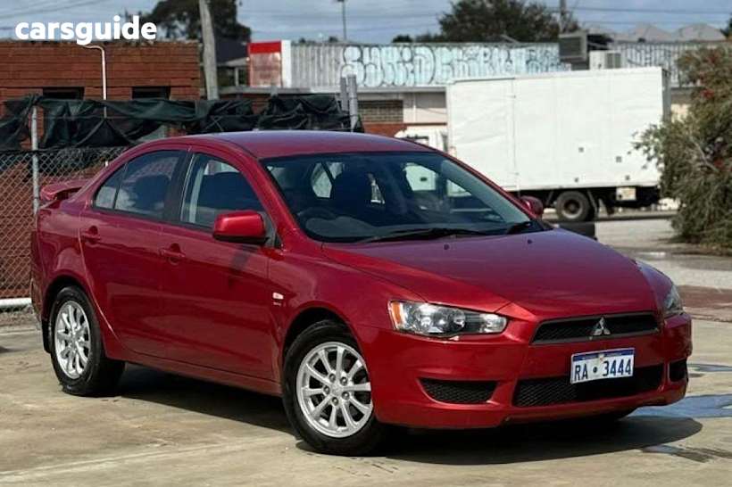 Red 2010 Mitsubishi Lancer Sedan VR F