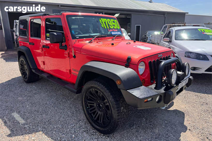 Red 2013 Jeep Wrangler Softtop Unlimited Sport (4X4)