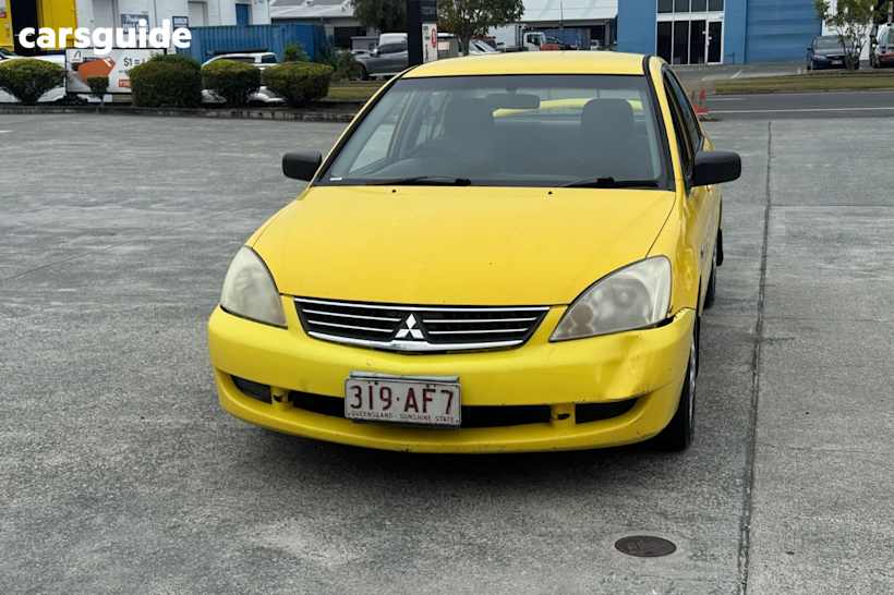 Yellow 2006 Mitsubishi Lancer Sedan Es