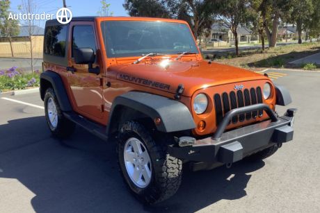 Orange 2011 Jeep Wrangler Softtop Sport (4X4)