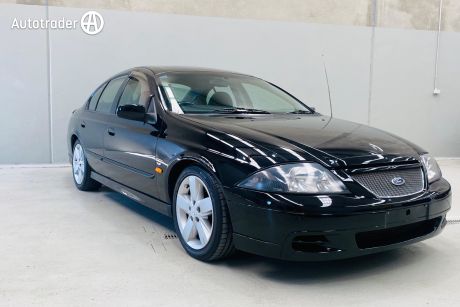 Black 1999 Ford TE50 Sedan -