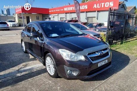 Red 2012 Subaru Impreza Sedan 2.0I-L (awd)